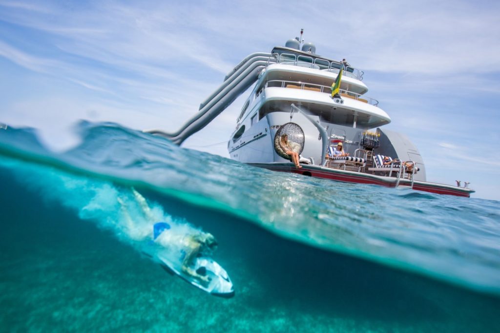 Woman on underwater ski playing in Caribbean off 52 ft Trinity motor yacht ZOOM ZOOM ZOOM