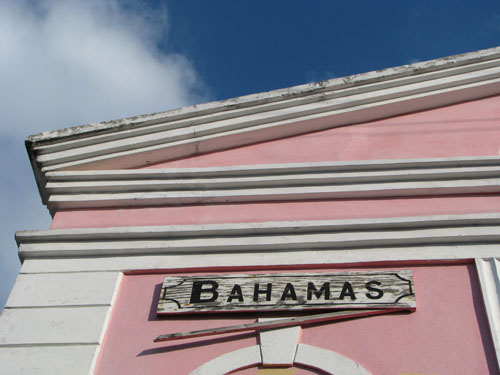 Bahamas sign on classic pink building in Bimini