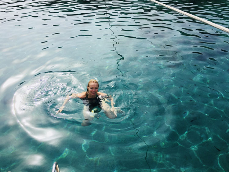 Swimmer takes a plunge into blue waters of the Mediterranean