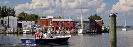 Boat cruising through harbor in Cambridge, Maryland