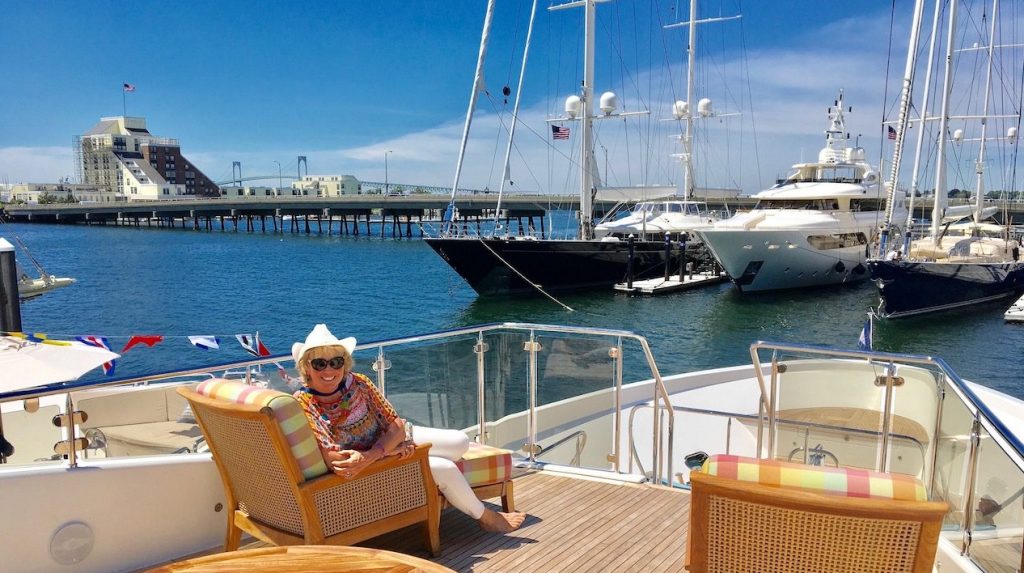 Carol Kent in a comfy chair on board a yacht deck in Newport, Rhode Island