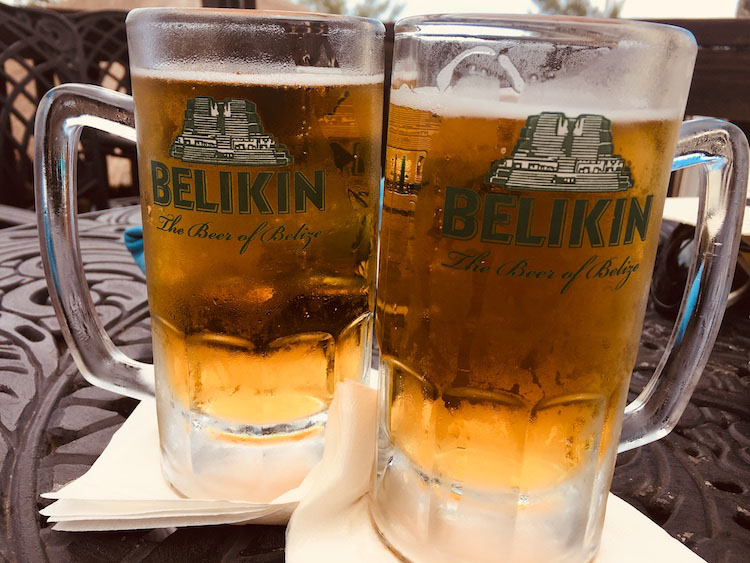 Two frosty mugs of Belitung beer in Belize