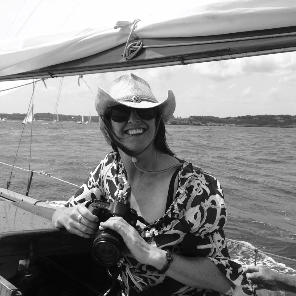 Sue Gearan with camera on board a sailboat