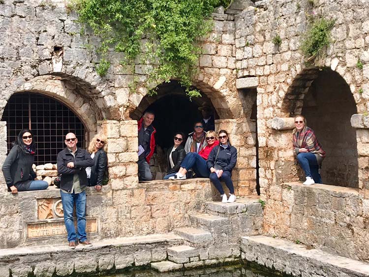Carol on a fam trip with fellow yacht charter brokers at Courtyard Pond at Tvrdalj Fortress, Stari Grad, Hvar, Croatia