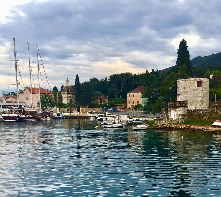 Stari Grad harbor in Croatia with lovely stone buildings and boats