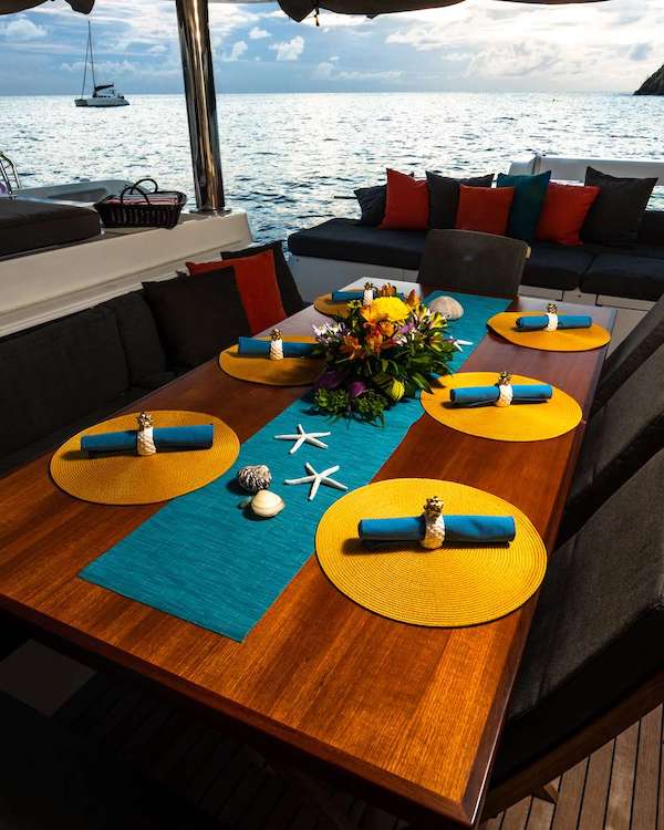 Al fresco breakfast Nook with starfish table setting on 62ft Lagoon Sailing Catamaran