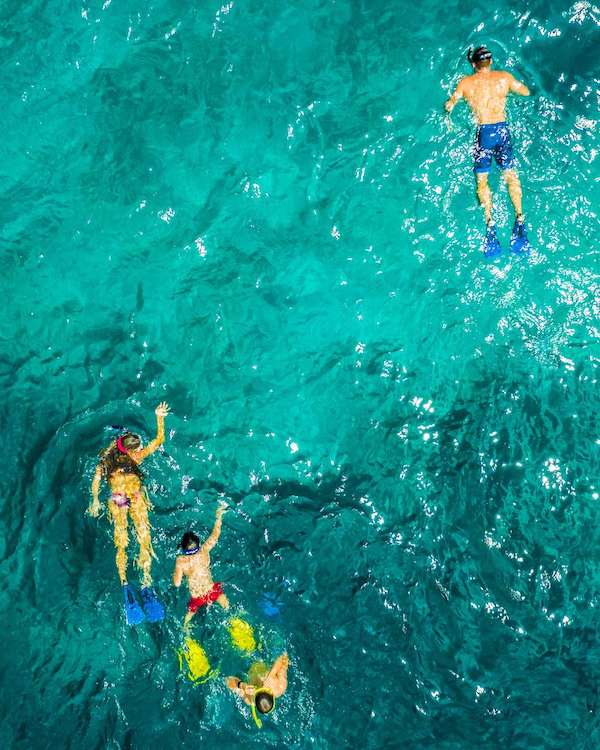 Family snorkeling off 62ft Lagoon sailing catamaran TWIN FLAME
