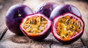 Passion fruit whole and cut in half
