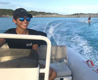 First Mate Raven of sailing catamaran LOLALITA driving the boat's tender