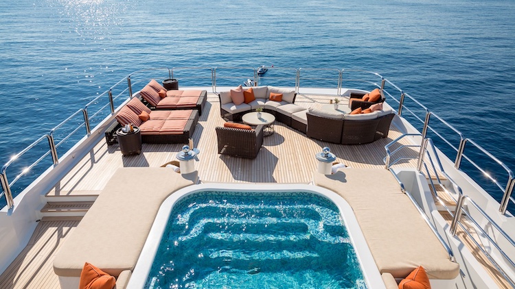 Aft deck with jacuzzi and lounge furniture aboard the 205ft Oceanco motor yacht LUCKY LADY