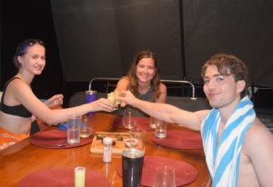 Cuttino kids toast to their good fortune during a family vacation on the 52ft S/Y catamaran STOP WORK ORDER in St. Croix, US Virgin Islands