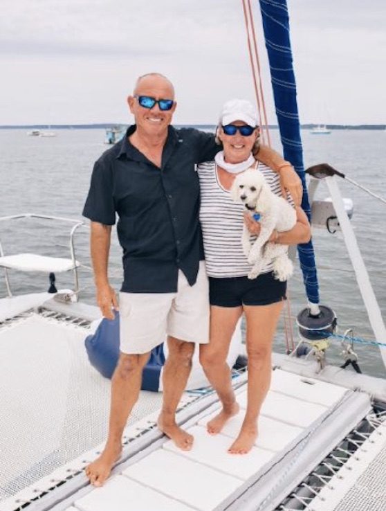 Capt. Steven & Capt. Bonnie Carroll w dog Sailor aboard 50ft sailing catamaran PARADIGM SHIFT