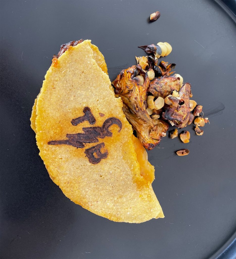 TCB top chef Alex Flannery offered a variety of food including his signature child's halibut with pickled cauliflower and rhubarb tacos. Photo by Billy Black Newport CYS 2022