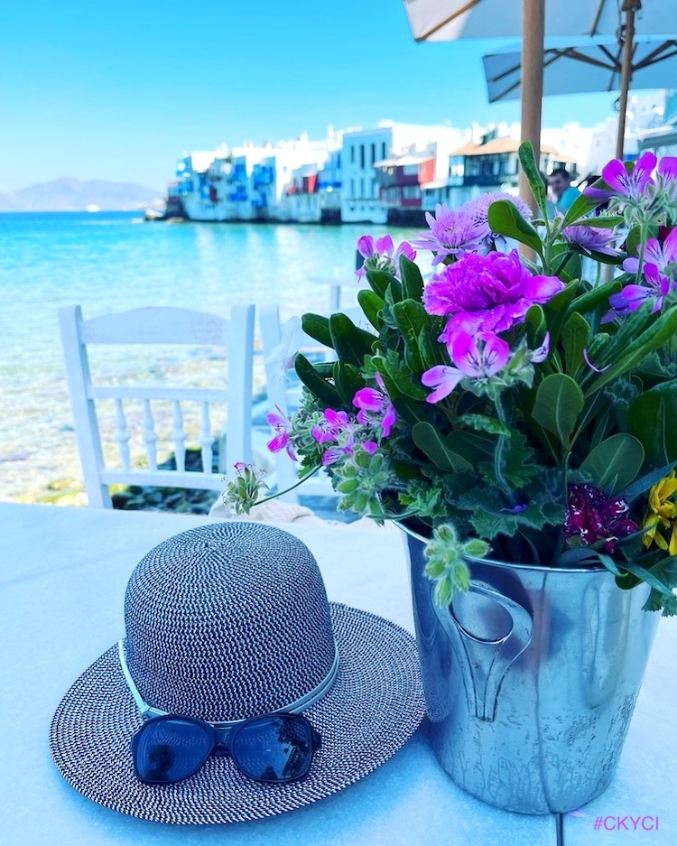 Carol's hat and flowers at a café in Little Venice, Mykonos, Greece