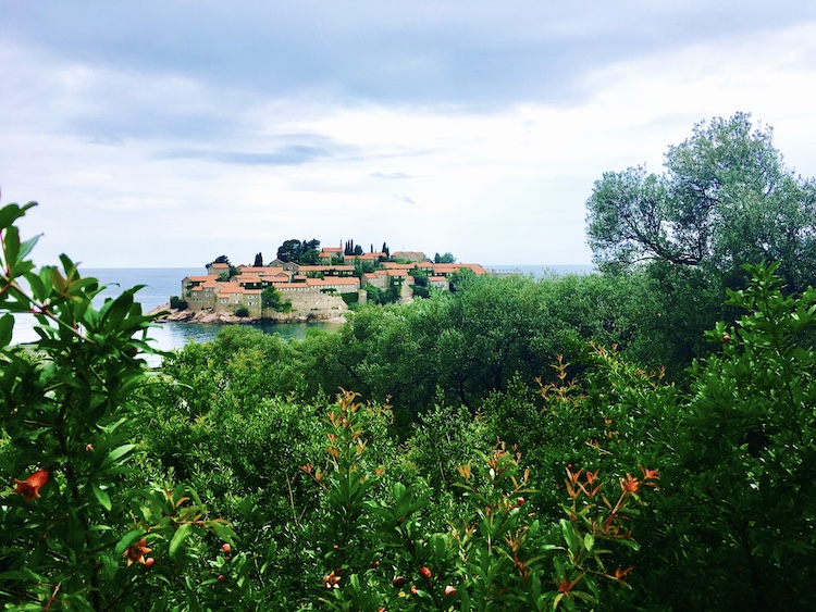 Red-roofed builings in Sveti Stefan on the coast of Montenegro. Photo©carolkent.com