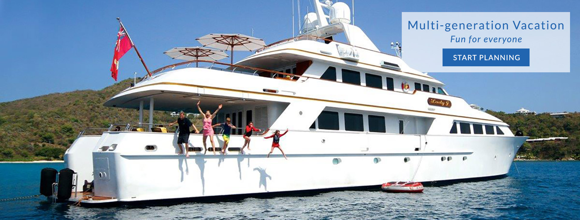 Family jumping into the water from motor yacht LADY J in the Caribbean